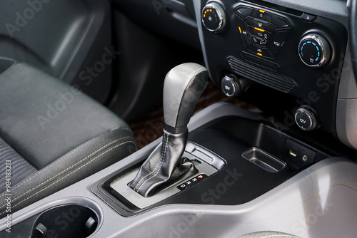 automatic transmission shift selector in the car interior. Closeup a manual shift of modern car gear shifter. 4x4 gear shift