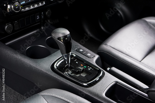 automatic transmission shift selector in the car interior. Closeup a manual shift of modern car gear shifter. 4x4 gear shift