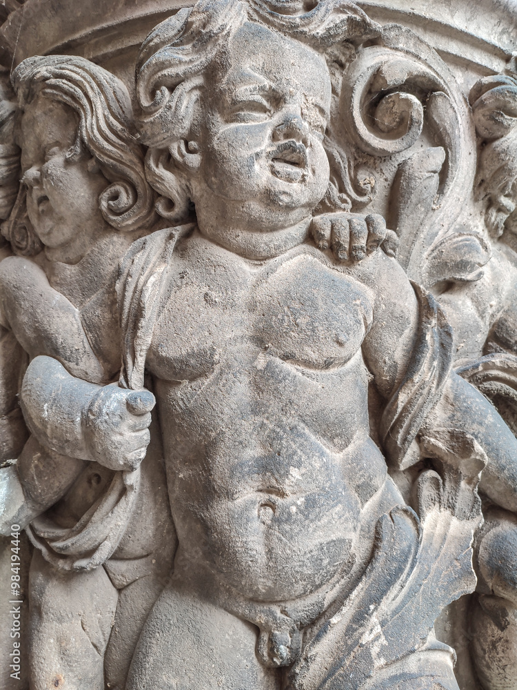 Dresden, Germany, old art sculptures, column stucco molding of young boys as angels, slaves and soldiers, gatekeepers Dresden, Germany, old art sculptures, column stucco molding of young boys as angels, slaves and soldiers, gatekeepers