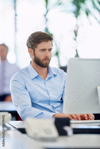 Office, businessman and thinking with computer for typing, page update and online information. Career, male web designer and research with digital for application progress, download and connectivity