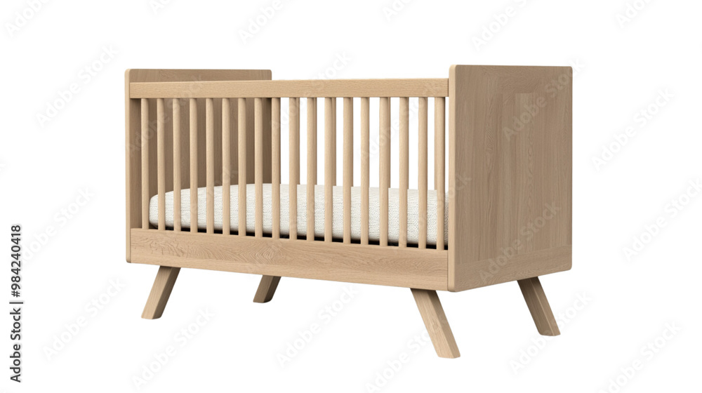 A wooden crib with a white sheet on it A wooden crib with a white sheet on it
