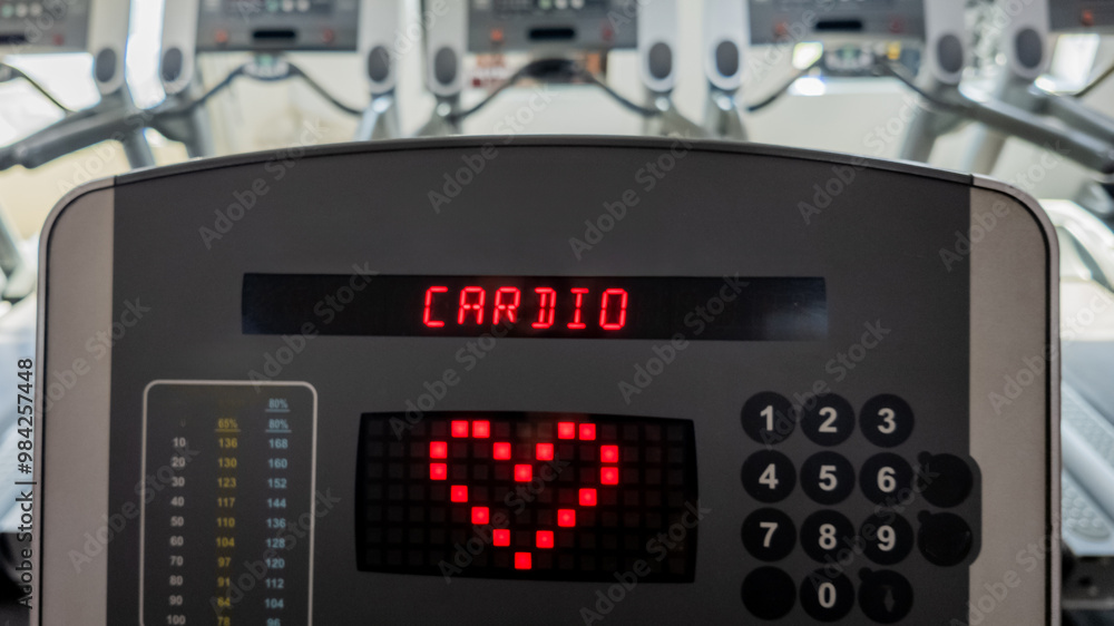Digital display on a treadmill emphasizing cardio workouts for heart health and fitness in a modern gym environment Digital display on a treadmill emphasizing cardio workouts for heart health and fitness in a modern gym environment