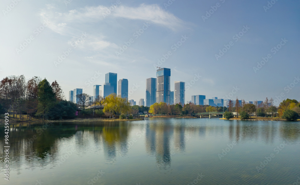 Serene Urban Landscape with Reflections in Tranquil Lake Serene Urban Landscape with Reflections in Tranquil Lake