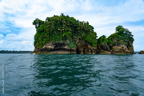 Tropical Paradise of Isla de los Pájaros, Panama, A Scenic Haven with Lush Vegetation, Wildlife, and Exotic Coastal Rock Formations in the Caribbean Sea photo