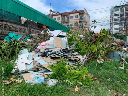 Urban Waste Pile with Branches, Construction Debris, and Plastic Waste.