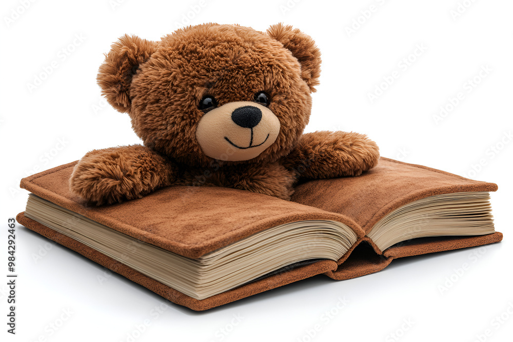 a teddy bear on a book
a teddy bear on a book