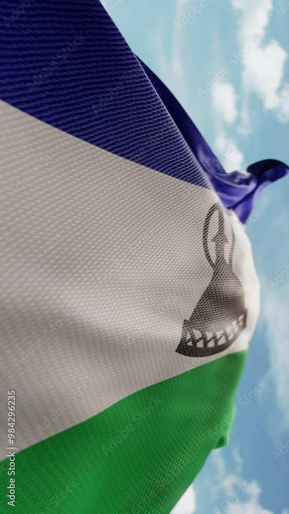 Wavy flag of Lesotho blowing in the wind in slow motion. Waving ...