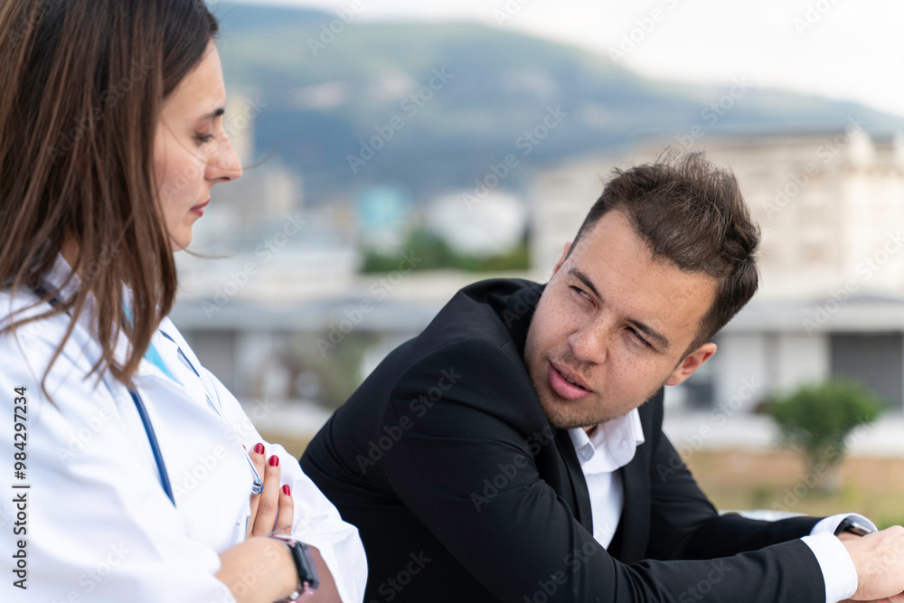 A man and a woman are standing on a balcony, the man is wearing a suit A man and a woman are standing on a balcony, the man is wearing a suit