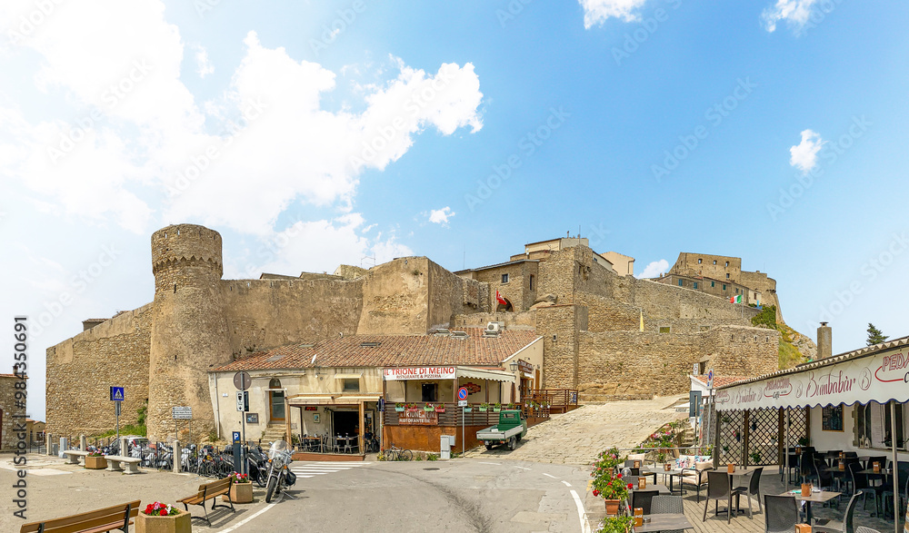 Naklejka premium Giglio, Italy - 29.5.2024: Old town of Giglio Castello at Isola del Giglio, island of the tuscan archipelago, beautiful ancient rustico buildings and historical architecture, Grosseto Tuscany Italy
