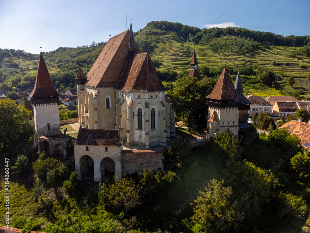 Naklejka premium Drone view of a Medieval Fortified Church of Biertan in a sunny day of summer in Romania