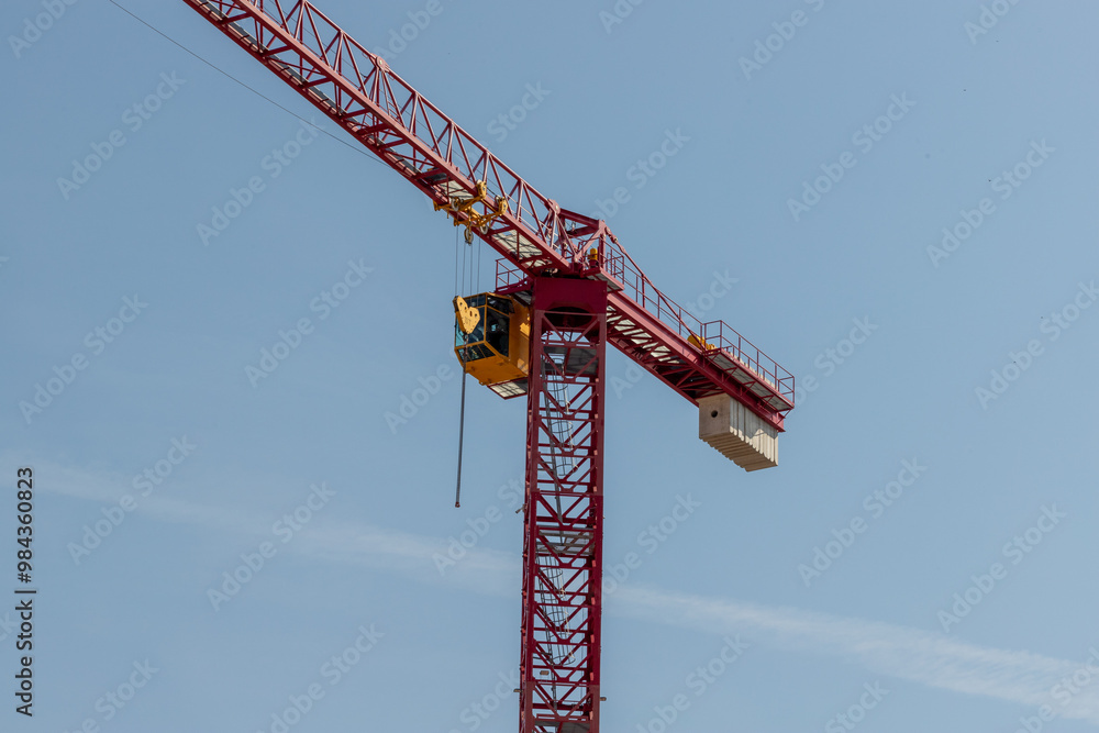 Crane (jib, operator's cab, counter-jib and mast) with blue sky Crane (jib, operator's cab, counter-jib and mast) with blue sky