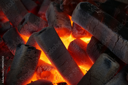 Burning fuel briquettes for fireplace, stove or boiler photo