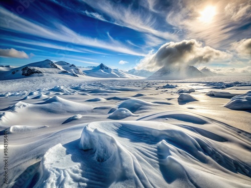 Bitter winds howl across the barren, snow-drifted terrain, leaving behind a trail of frozen crystals, devoid of life or color. photo