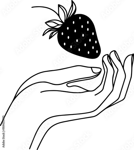 hand holding a strawberry