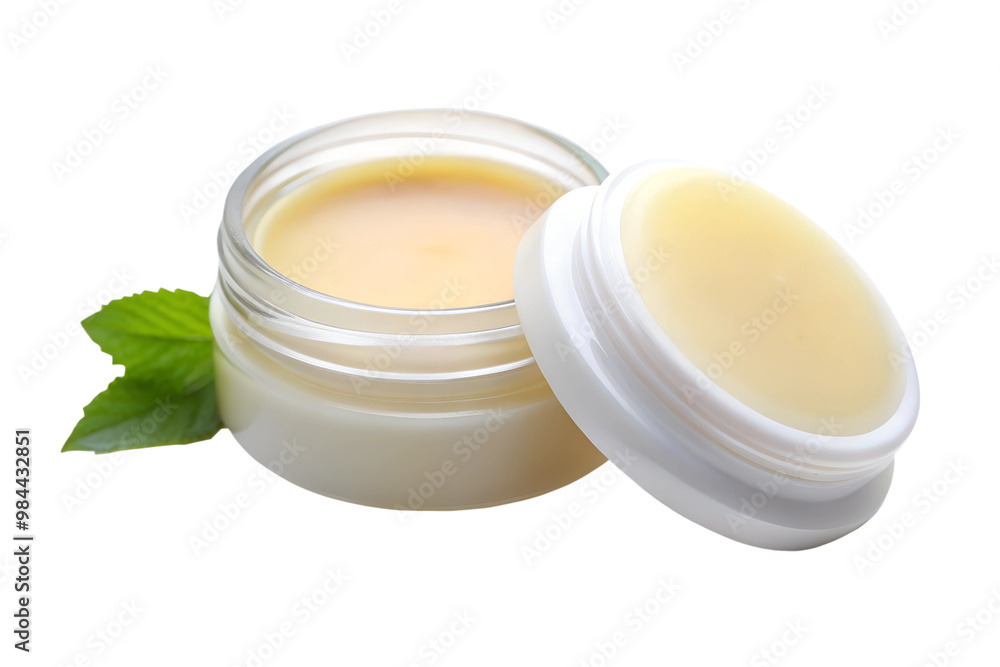 Natural lip balm in glass jar with green leaves isolated on transparent background Natural lip balm in glass jar with green leaves isolated on transparent background