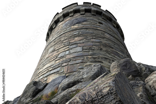 A close-up view of a historic stone tower, highlighting its architectural details and rugged surroundings. photo