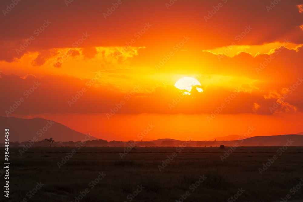 Stunning African Sunset Over the Savanna in Amboseli National Park, Kenya – Vibrant Sky and Scenic Landscape Stunning African Sunset Over the Savanna in Amboseli National Park, Kenya – Vibrant Sky and Scenic Landscape