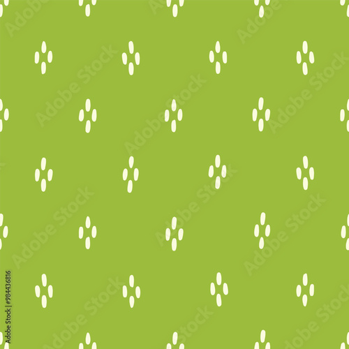 Seamless vector pattern with clusters of hand drawn white dots on brat green, textile print