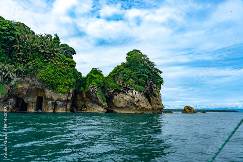 Stunning Tropical Scenery of Isla de los Pájaros in Bocas del Toro, Panama Featuring Lush Vegetation, Wildlife, and Dramatic Coastal Rock Formations in the Caribbean Sea photo