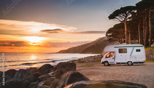 Fototapeta Naklejka Na Ścianę i Meble -  Table background with a wooden board and sunny beach and ocean and a camper van
