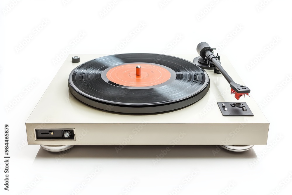 Fototapeta premium Crisp image of a white vintage turntable playing a vibrant vinyl record, exhibiting the charming contrasts and nostalgic feel of classic music playing devices.