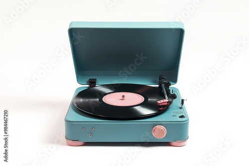 A contemporary-styled turquoise record player with pink accents, featuring an open lid and a vinyl record on its turntable. Perfect for adding a modern twist to vintage charm. photo