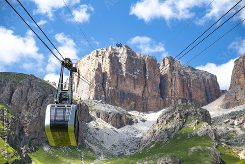 Sass Pordoi cable car moving up to the mountain top, Dolomites, Italy photo