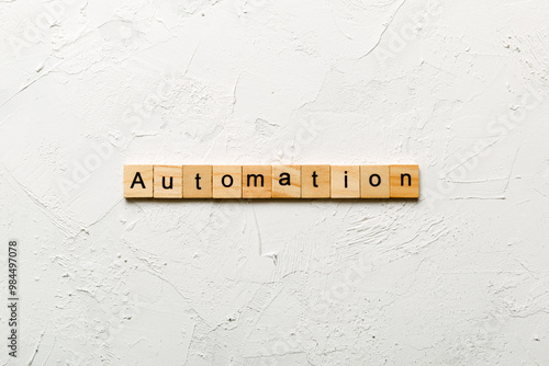 Automation word written on wood block. Automation text on cement table for your desing, concept photo