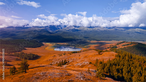 Beautiful landscape autumn lake Dzhangyskol with reflection of mountains Altai, aerial view