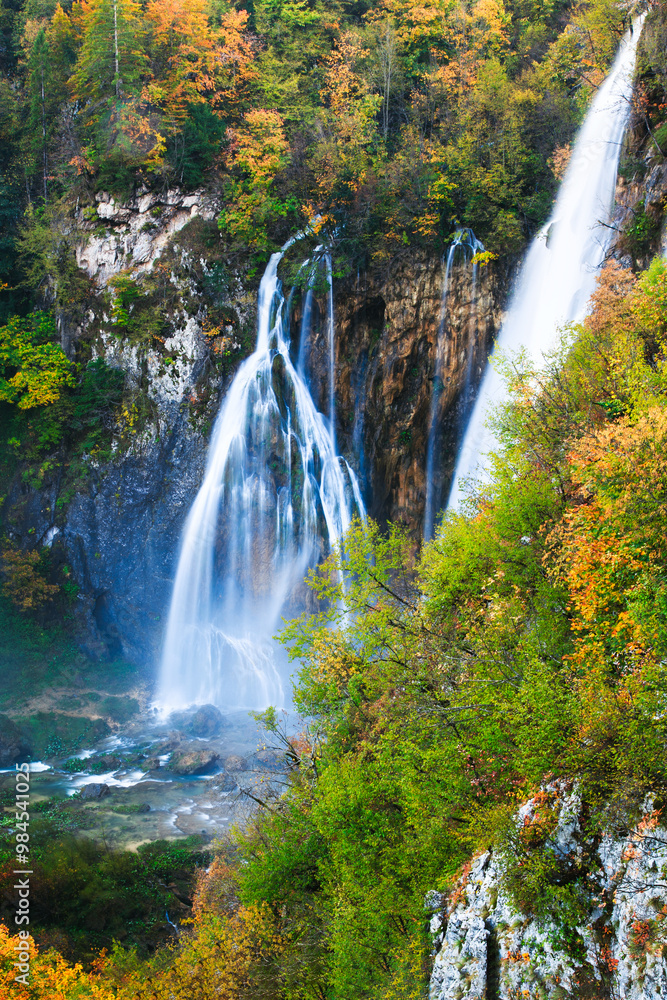 Scenic Autumn Waterfall in Serene Forest Setting