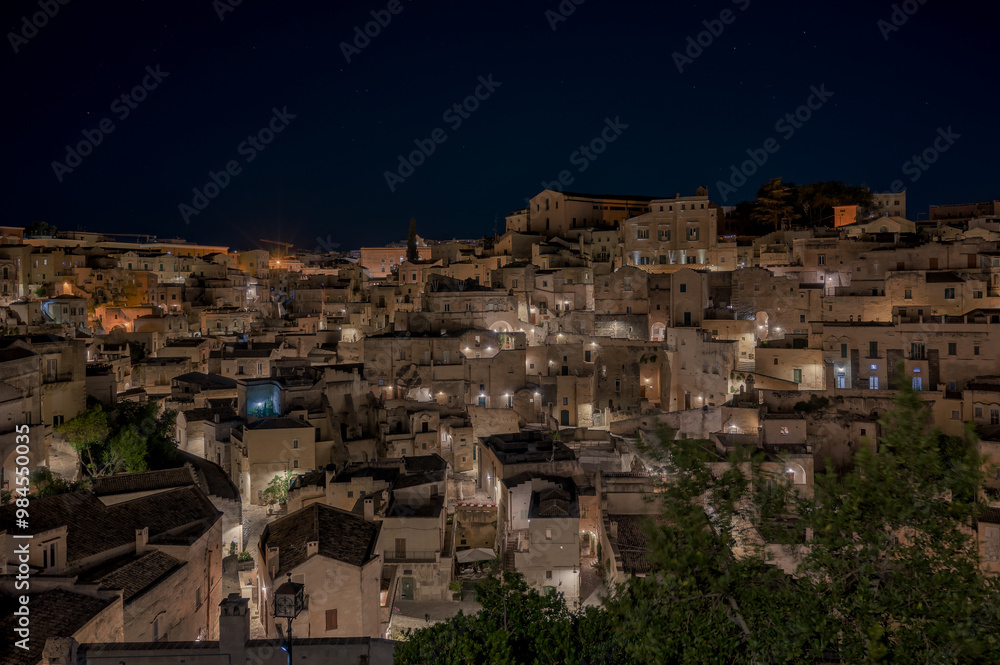 Blurry city picture at night with many lit buildings Blurry city picture at night with many lit buildings