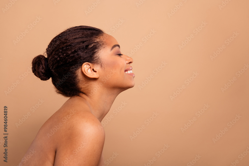Photo of stunning dreamy lady toothy smile profile bare shoulders isolated on beige pastel color background Photo of stunning dreamy lady toothy smile profile bare shoulders isolated on beige pastel color background