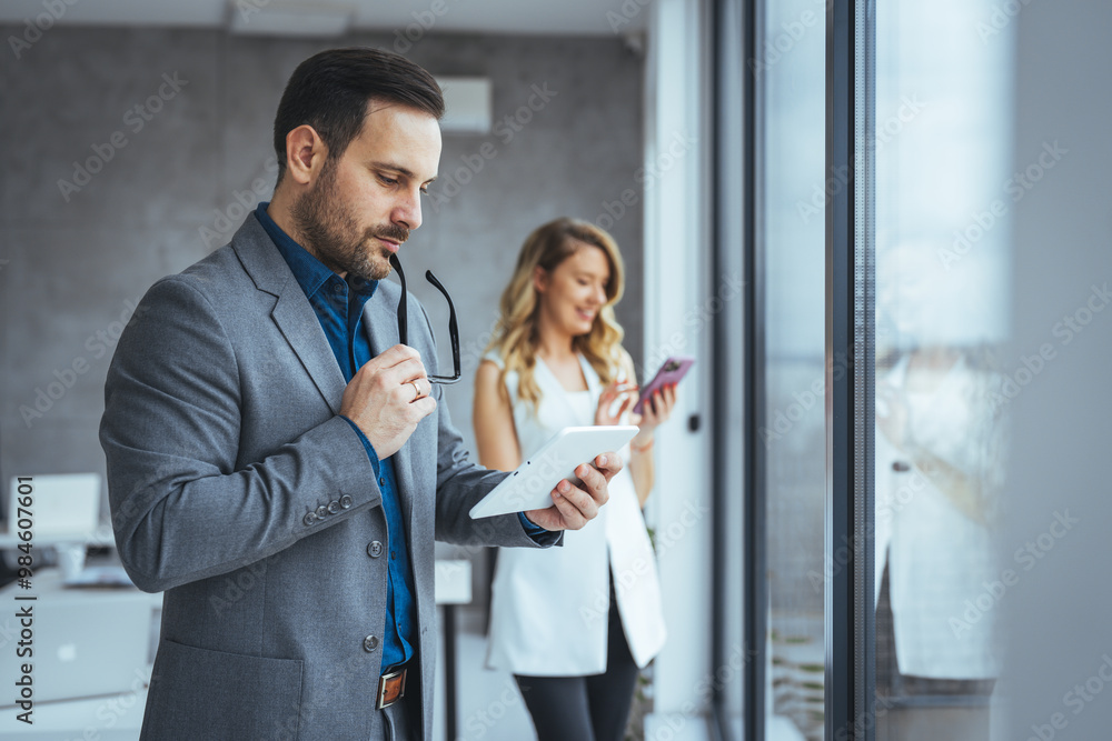 Professional Business Team Working with Digital Devices in Office Professional Business Team Working with Digital Devices in Office