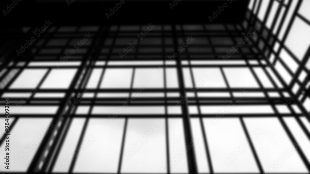 Black and white blurred image of the structure and glass of an office building. Black and white blurred image of the structure and glass of an office building.