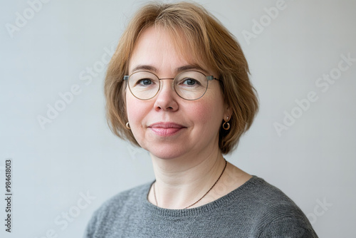 Elegant Professional Portrait of a Mature Germanic Woman Wearing Casual Natural Clothes with a Confident Smile in a Studio Setting for Business and Professional Use