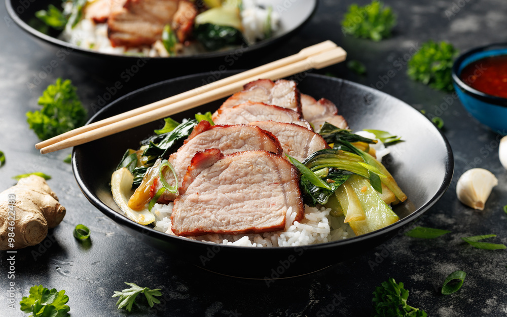 Chinese BBQ Pork Char Siu with rice and bok choy in a black bowl Chinese BBQ Pork Char Siu with rice and bok choy in a black bowl