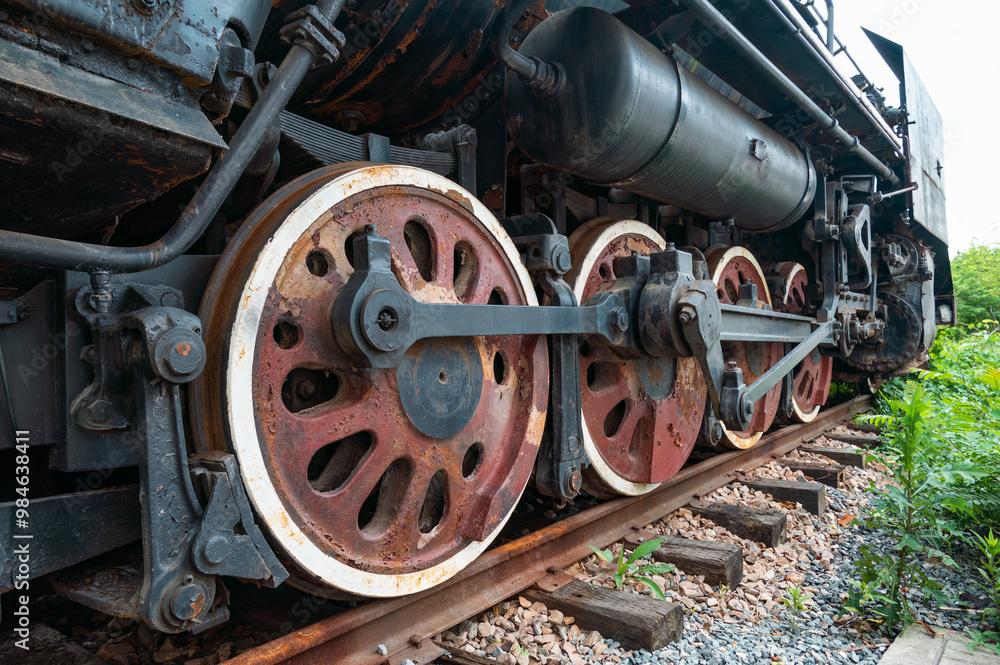 Close up of old industrial style steam locomotive wheels. Close up of old industrial style steam locomotive wheels.