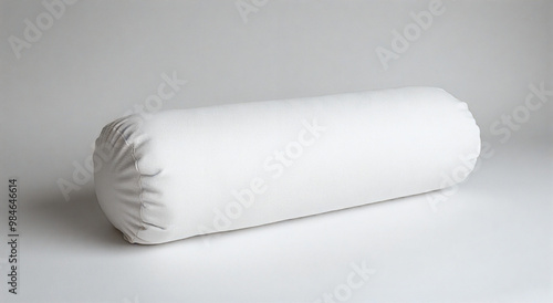 Elegant white bolster pillow isolated on a clean white background, perfect for minimalist interior designs and home accessories.