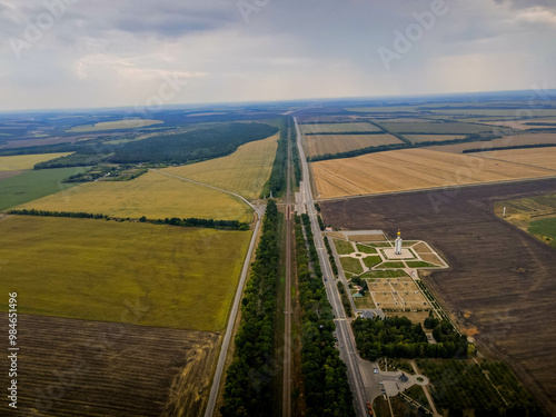 The straight road between the agricultural land in western Russia, close to Ukraine border, at Belgorod oblast of Russia, a location of Kursk battle at WWII.
 photo