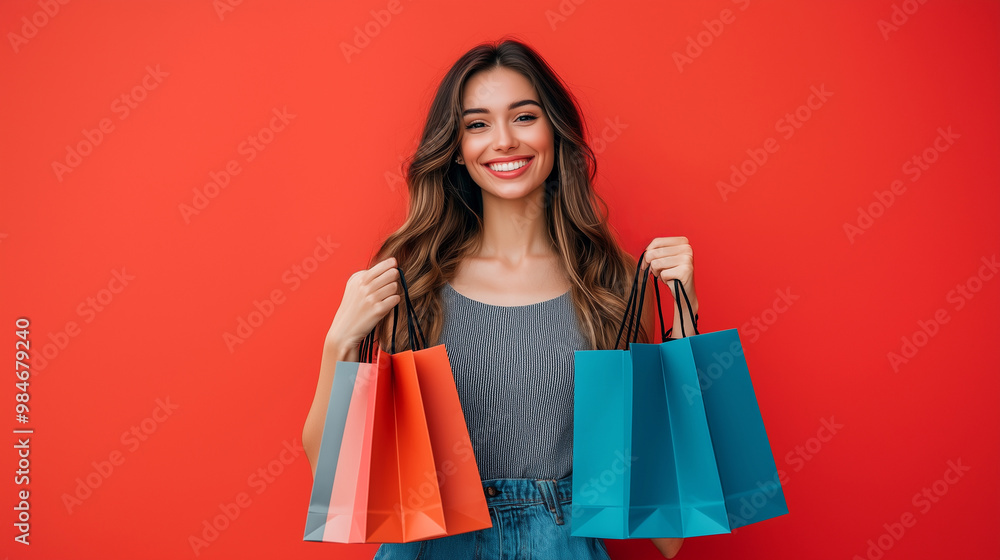 A waist-up portrait of a beautiful woman smiling joyfully, holding stylish shopping bags in both hands. The background is a vibrant, trendy colour. Aesthetically pleasing. Space for text, advertising A waist-up portrait of a beautiful woman smiling joyfully, holding stylish shopping bags in both hands. The background is a vibrant, trendy colour. Aesthetically pleasing. Space for text, advertising