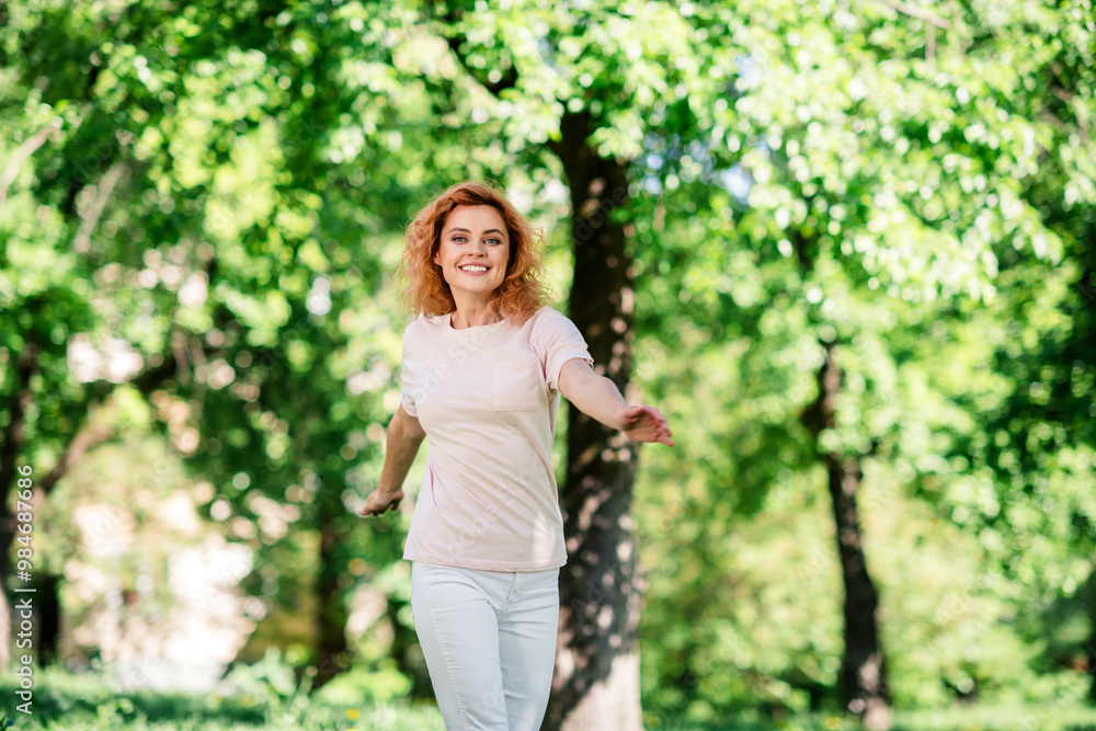 Portrait of pretty young woman enjoy weekend wear t-shirt walk fresh air trees park outdoors Portrait of pretty young woman enjoy weekend wear t-shirt walk fresh air trees park outdoors