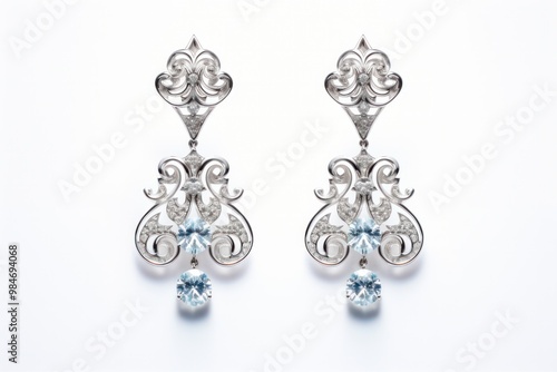 A pair of elegant diamond earrings showcasing intricate filigree work