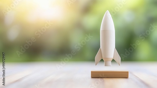 Whimsical Wooden Rocket Model on Tabletop, Capturing Childlike Imagination and Adventure in a Cozy Indoor Setting photo