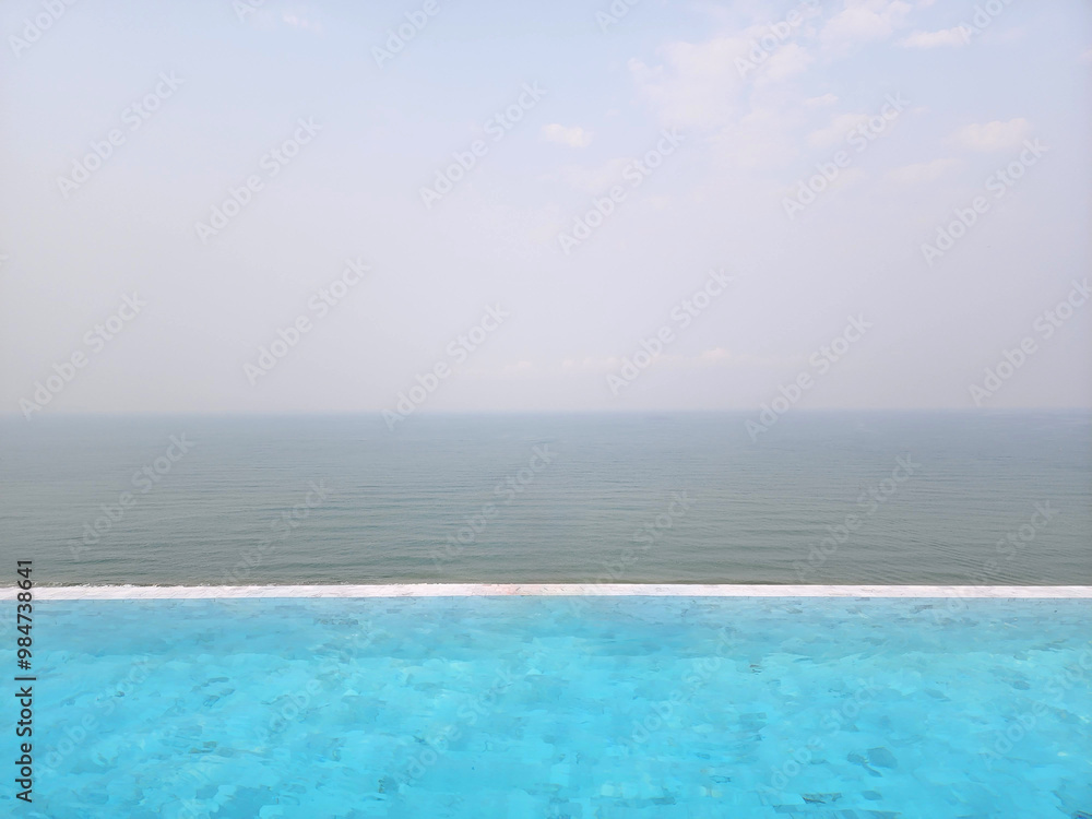 beach view photo concept, awesome swimming pool and sea view with clear blue sky beach view photo concept, awesome swimming pool and sea view with clear blue sky