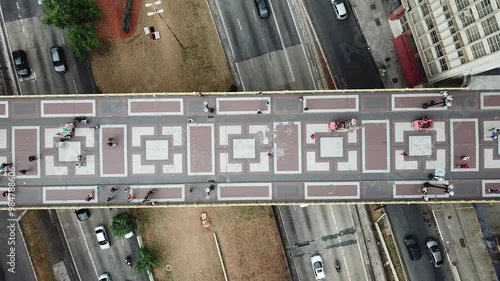 Top-down aerial view of Viaduto Santa Ifigênia in São Paulo, Brazil, showing the patterned pavement and pedestrians. photo