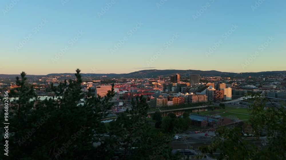 Oslo City Center, Norway in the Morning. Aerial Drone Shot. Moving Forward Slowly between Trees. Establishing Reveal Shot Oslo City Center, Norway in the Morning. Aerial Drone Shot. Moving Forward Slowly between Trees. Establishing Reveal Shot