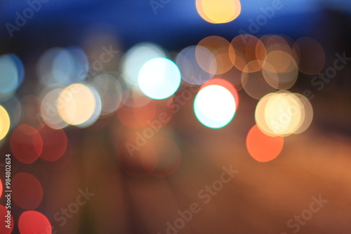 Fotografie City Lights Bokeh: A mesmerizing blur of vibrant city lights at night, creating an abstract and atmospheric bokeh effect