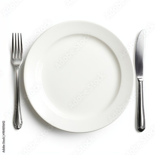 Empty western food plate and knife and fork, knife and fork on both sides of the plate