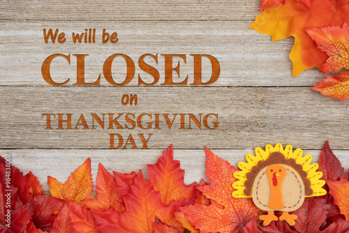 We will be closed Thanksgiving Day with fall leaves and turkey on weathered wood