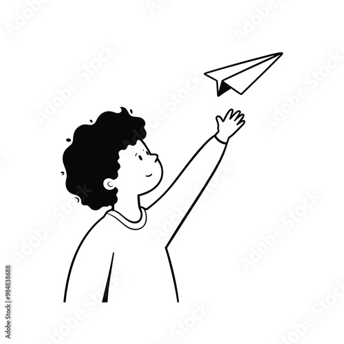 A young boy with curly hair joyfully throws a paper airplane in the air.